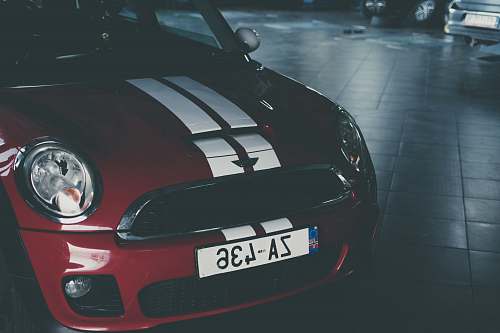 car red and white Mini Cooper automobile