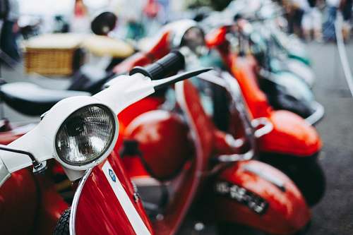 motorcycle red and white motor scooter parked selective photography scooter