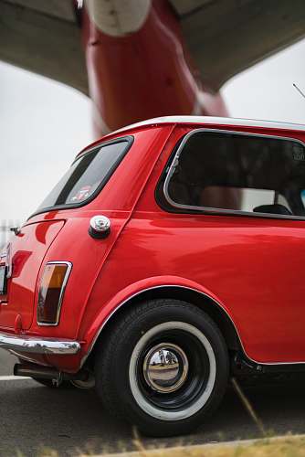 automobile selective focus photography of red hatchback during daytime car