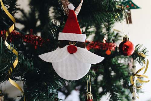 flora white and red Santa Claus head Christmas bauble abies