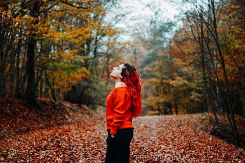 apparel woman wearing orange sweater during daytime clothing
