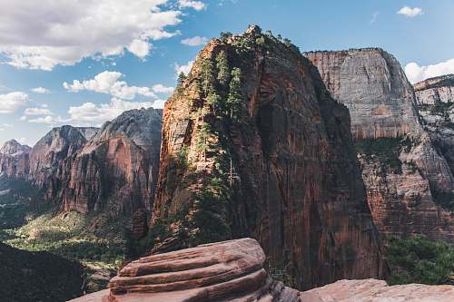 canyon photography of mountain under cloud sky plant