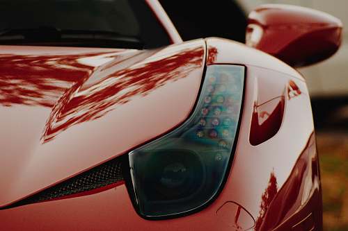 car macro photography of red sports car mini of sterling