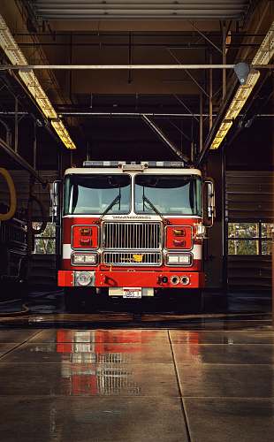 engine red firetruck on garage truck