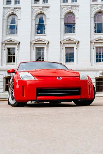 car red Nissan vehicle transportation