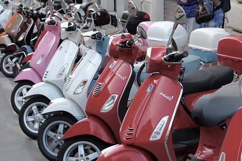 transportation red, white, and pink automatic scooters vespa