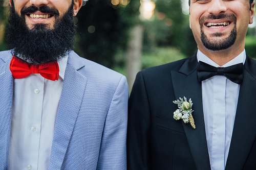 suit two men standing next to each other person