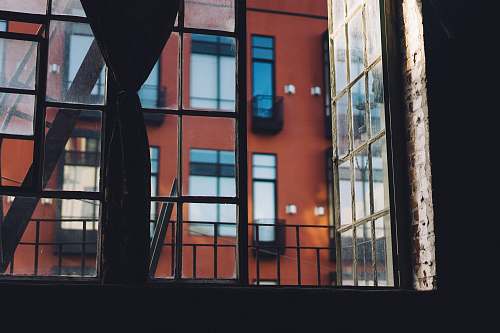 building minimalist photo of glass window with building view red