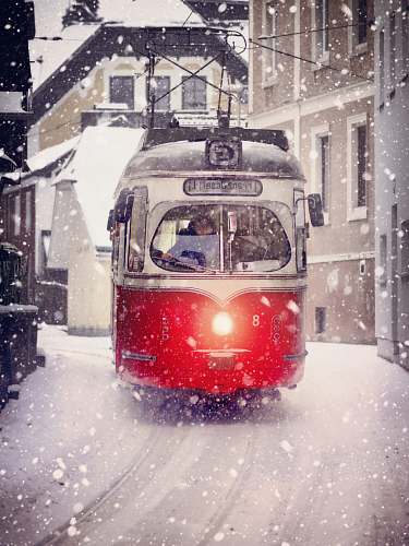 snow white and red cable train during winter outdoors