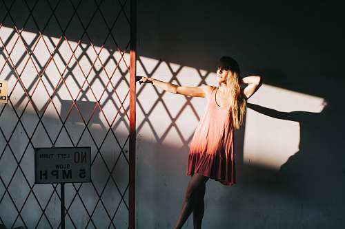 girl woman holding red steel gate leisure activities