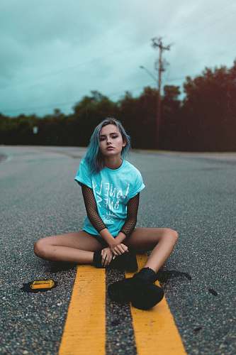 people woman sitting on road person