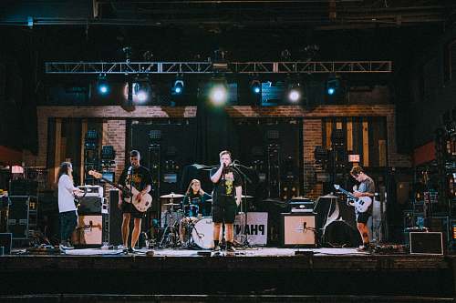 person band performing on stage human