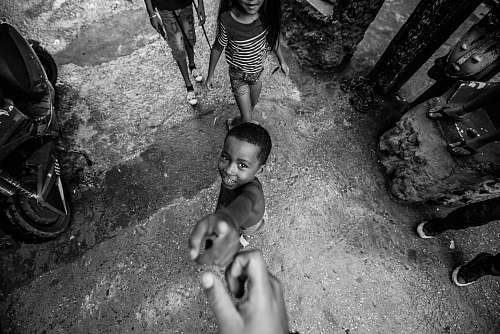 human boy pointing his finger black-and-white