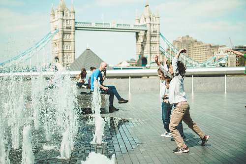 human children playing near fountain person