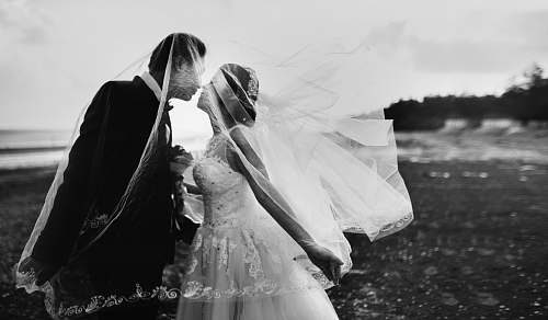 black-and-white grayscale shot of bride and groom wedding