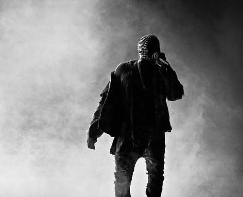 person grey scale photography of man standing fronting fog black-and-white