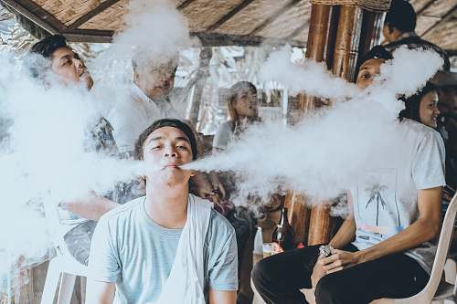 person group of people vaping on gazebo human