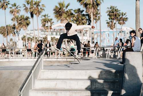 person man doing skateboard trick skateboard