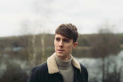 human man in gray turtleneck top standing person