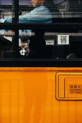 person man inside orange bus human