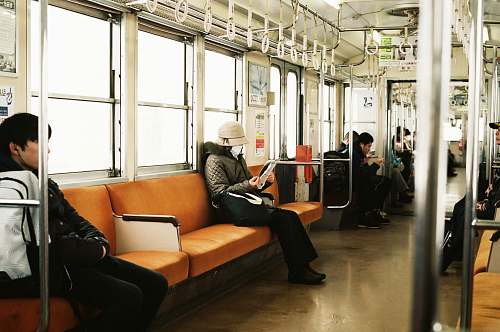 couch man sitting inside the train furniture