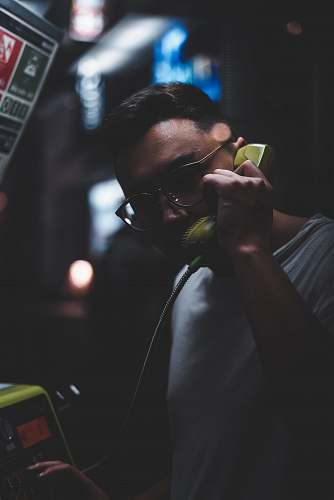 human man standing holding telephone person