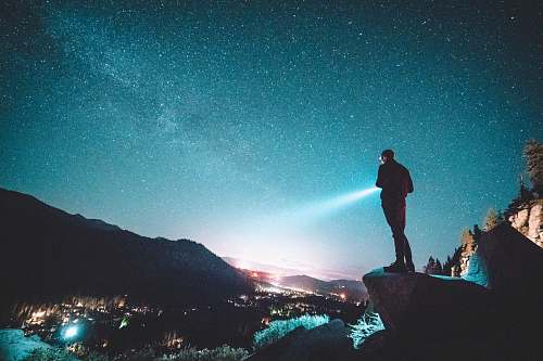 human man standing near cliff person