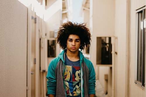 hair man standing near door afro hairstyle