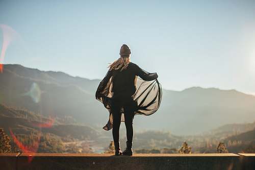 human man standing on brown concrete surface person