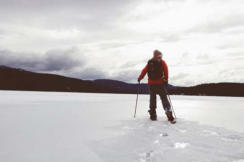 person man standing on snow covered surface human