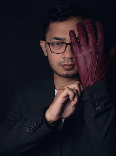 human man wearing brown gloves person