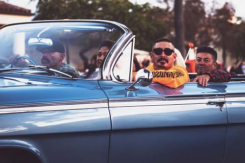 convertible men ridding vintage convertible car automobile