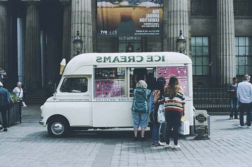 human people lined up at ice cream truck person