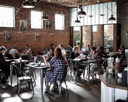 person people sitting on restaurant chairs chair