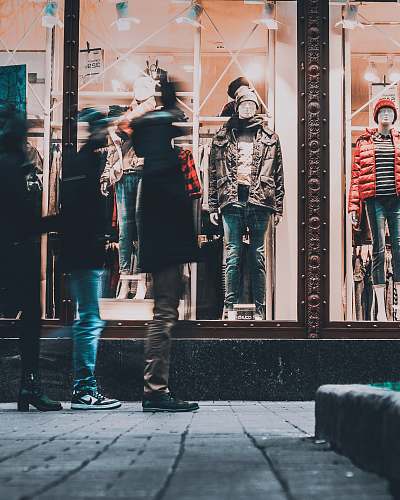 human people watching manequins wearing jackets person
