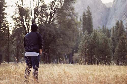 person person wearing black beanie and raglan shirt while being photograph during day time human