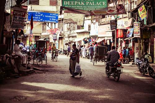 human photo of people on street during daytime motorcycle