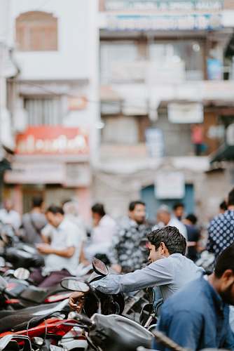 motorcycle selective focus photo of man riding motorcycle vehicle