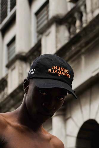 cap selective focus photography of man wearing cap hat