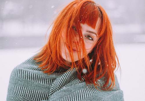 human selective focus photography of woman during snow person