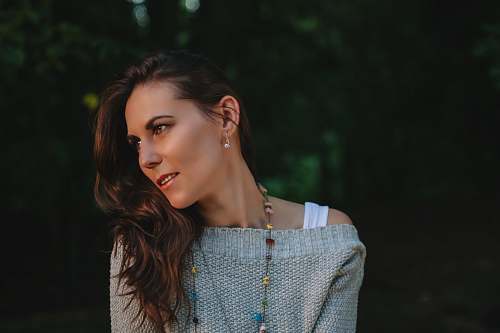 human shallow focus photography of woman in gray sweater person