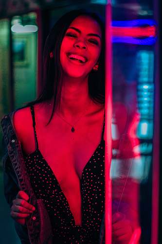 human smiling woman wearing black polka-dot top person