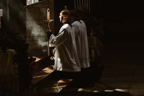 person two man worshiping god during daytime human