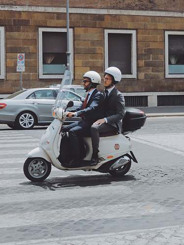 person two men riding on motor scooter human