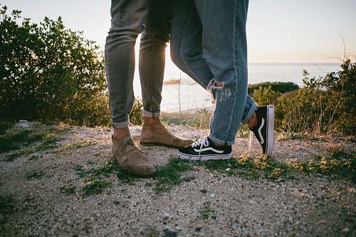 human two persons standing on sand person