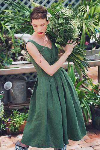 human woman carrying white flowers and green leaves person