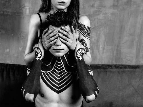 person woman covering man's eye black-and-white