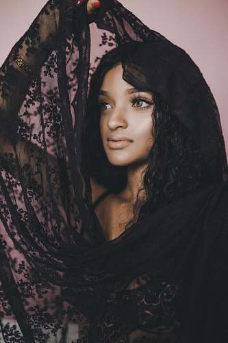 person woman holding black scarf human