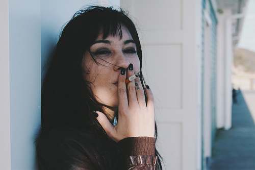 human woman holding cigarette stick person