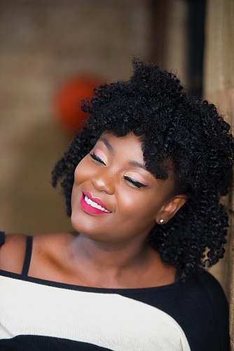 person woman in white and black top hair